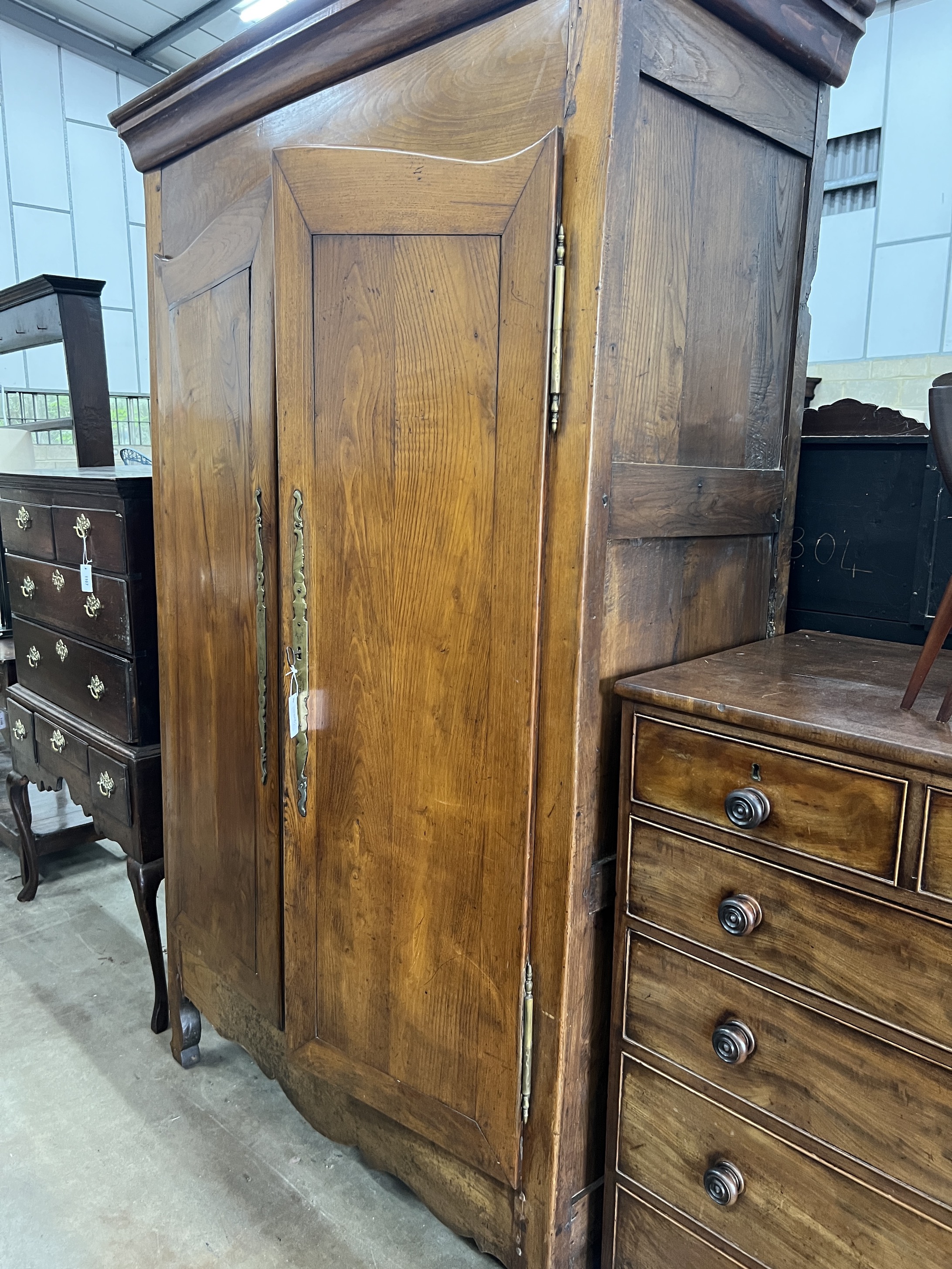 A 19th century French Provincial elm armoire, width 138cm, depth 60cm, height 226cm